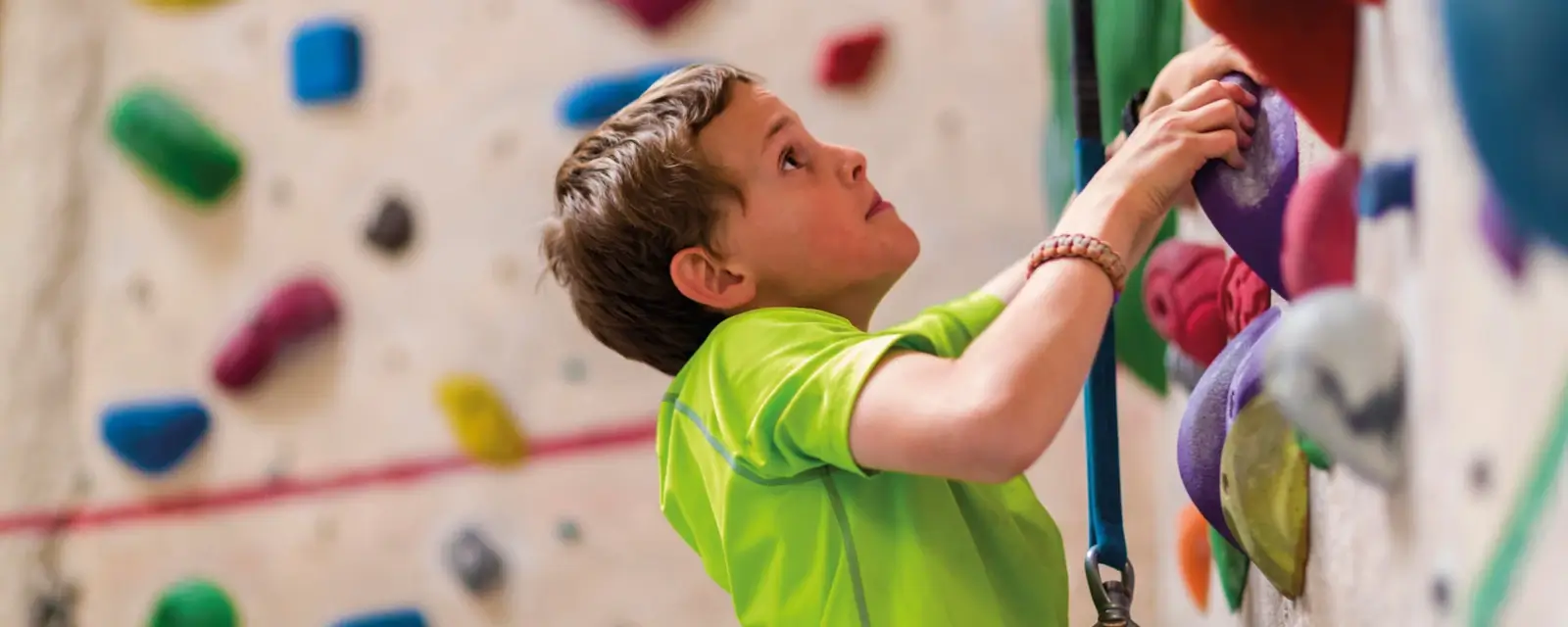 Boy on the climbing wall